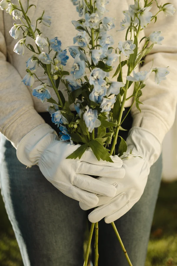 DRIFTWOOD GLOVE WITH FLOWERS IN BOTH HANDS