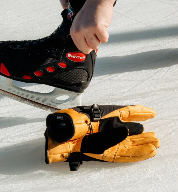 Snowpack gloves on the ground