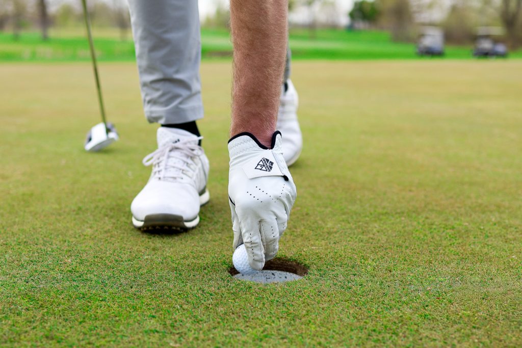 Saranac Golf Gloves being used in golf